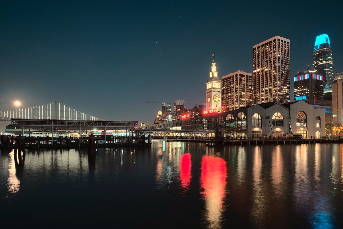 The Ferry Building and Bay Bridge at night, seen from Pier 1 in San Francisco
