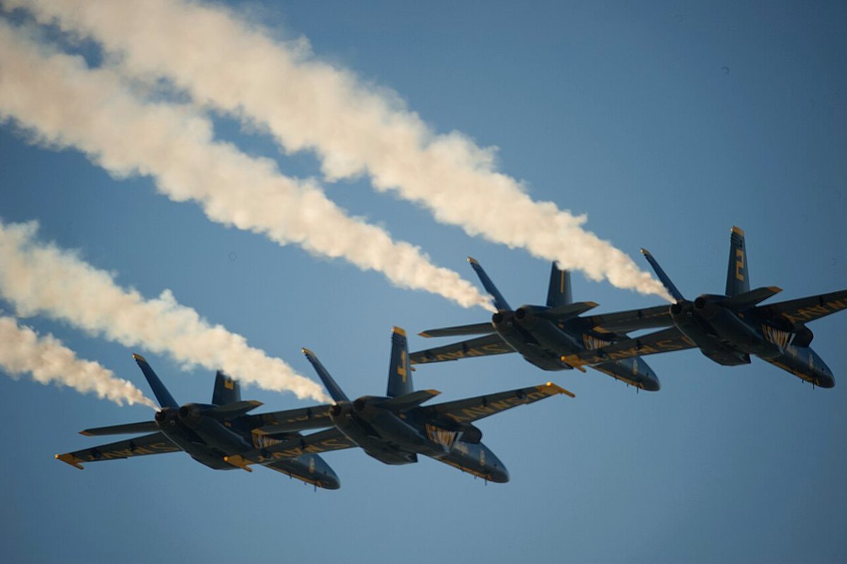 Four Blue Angels jets trailing smoke over San Francisco during Fleet Week 2026