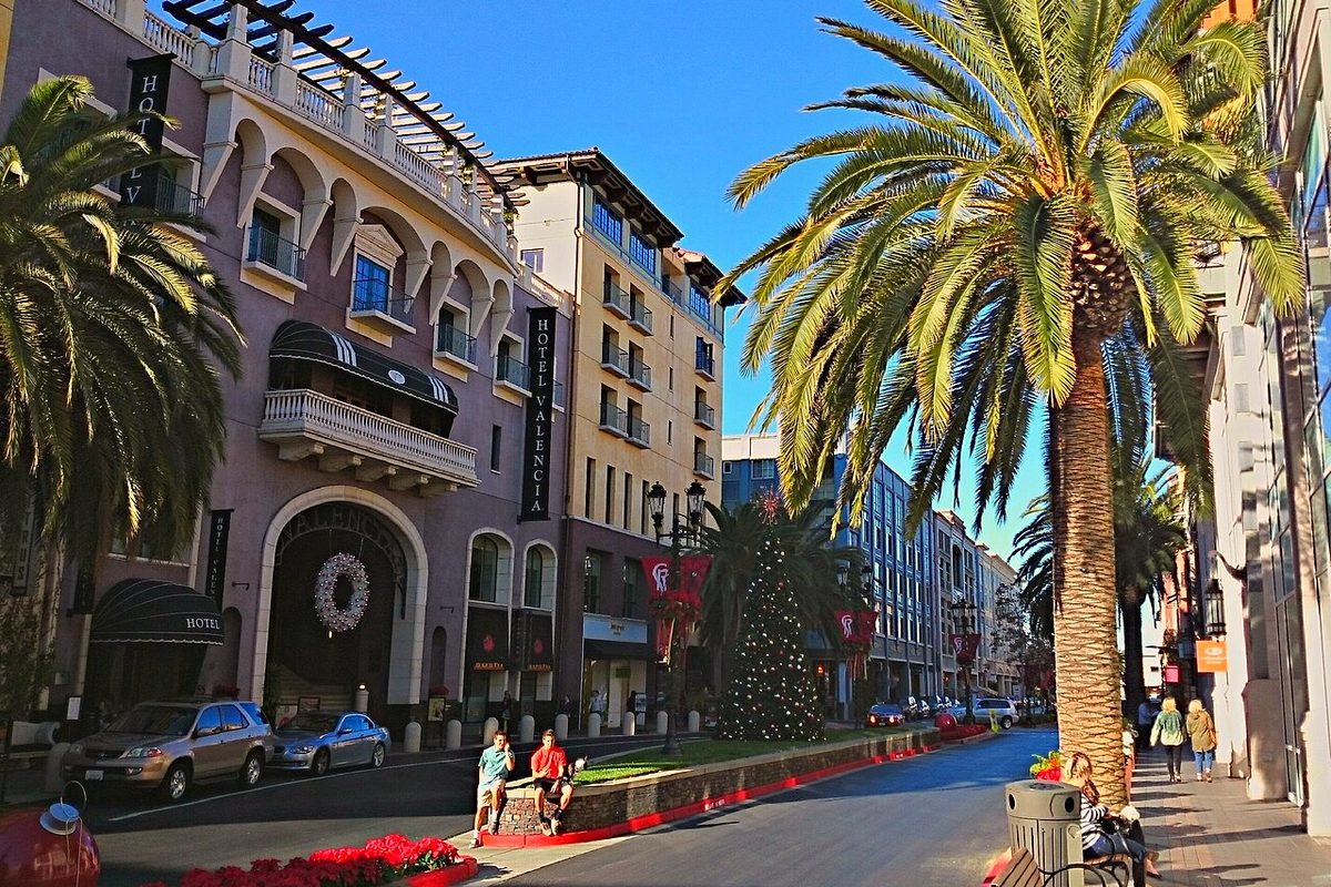 Palm trees and the Hotel Valencia at Santana Row in San Jose on a sunny day