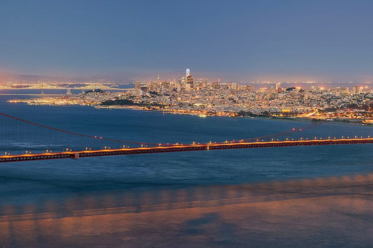 Golden Gate Bridge and the San Francisco skyline at blue hour, seen from Hawk Hill